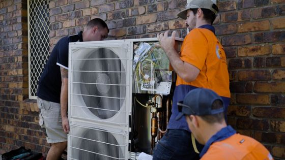 Technicians installing air conditioning in Brisbane